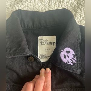 Cakeworthy ( Disney Villain ) black jean jacket .